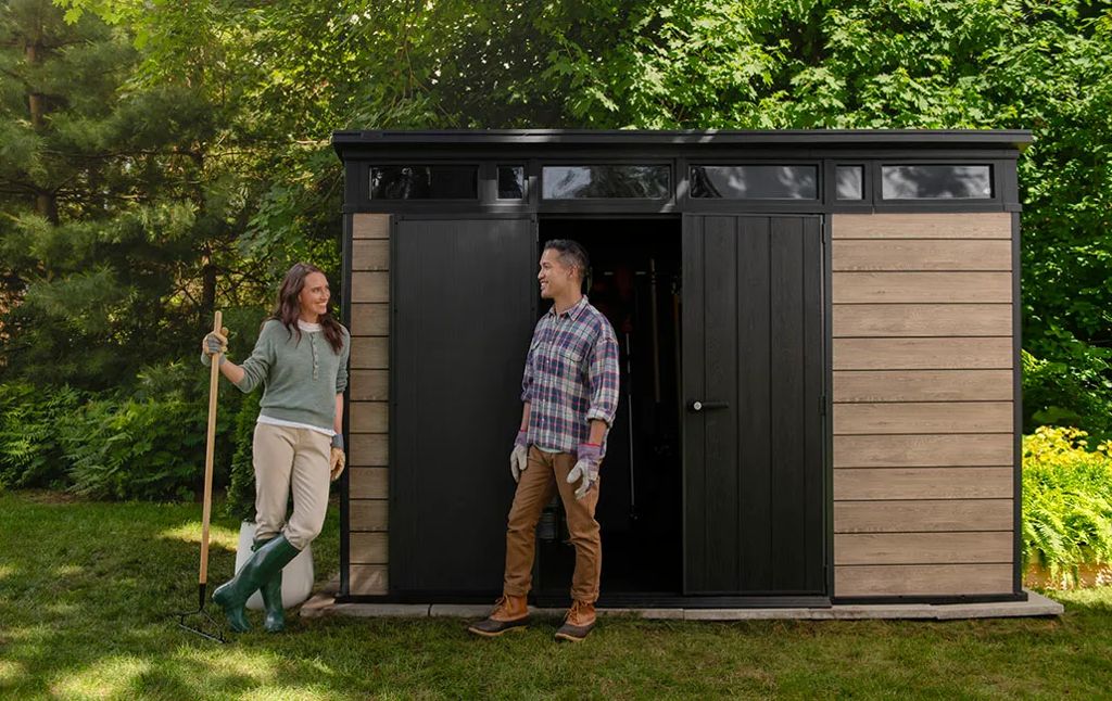 Keter Signature resin shed in a garden